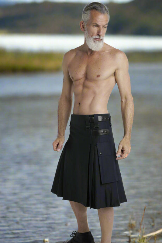 Man wearing a black kilt on a white background