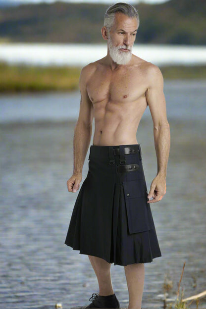 Man wearing a black kilt on a white background