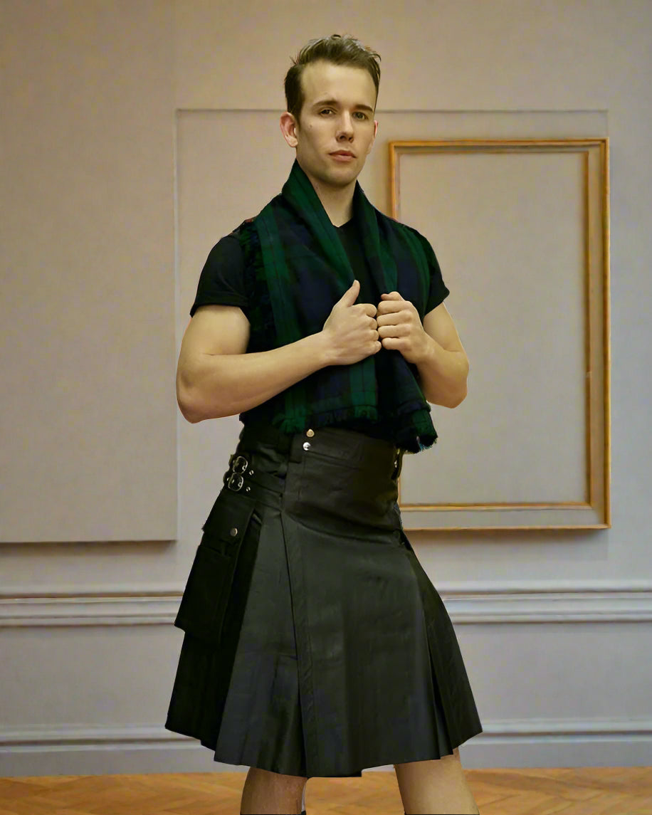 Man wearing a kilt and tartan scarf on a plain background